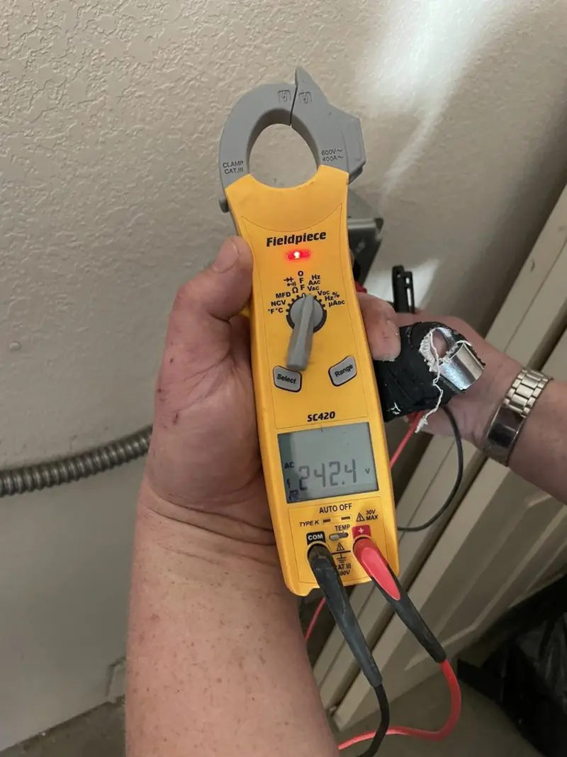 Voltage testing with clamp meter during Aluminum Wiring Replacement in Port Washington